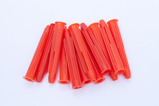 red plastic raw wall plugs 