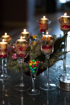 Christmas decoration with candle lights  on the table - vertical