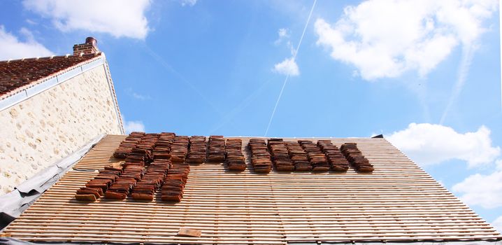 renovation of a tiled roof of an old house