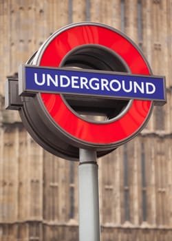 Bright red underground subway sign post