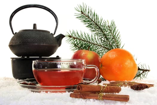 a cup of winter tea with fruit and spices