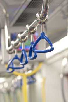 Handles for standing passenger inside a train