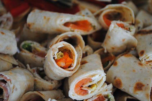 Smoked salmon wrapped in tortilla.