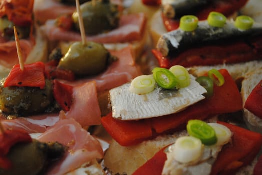 Tapas of sardines, onion and peppers.