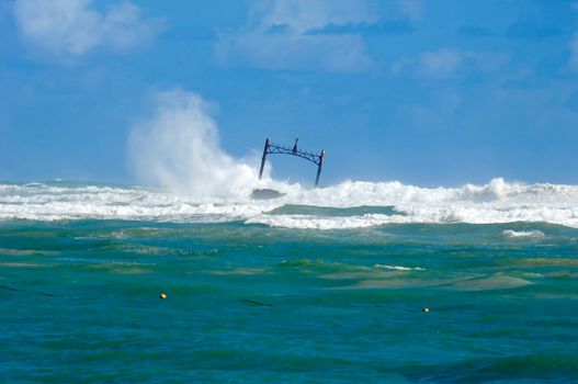 Sunken ship wreck and stormy sea with big waves
