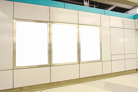 Blank billboard in train station