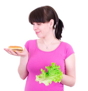 The young woman selects between a hamburger and salad