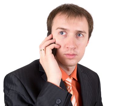 The businessman speaks by a mobile phone