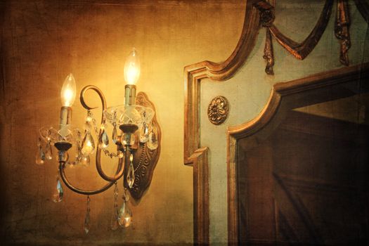 Antique wall light sconce with mirror and vintage background