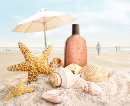 Suntan lotion and seashells with people on the beach