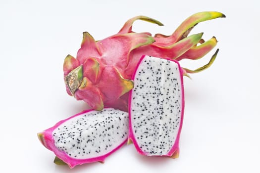 Vivid and vibrant dragon fruit isolated on white background