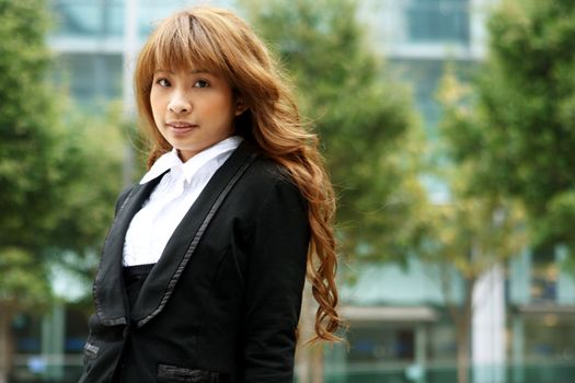 pretty asian business woman at office building 