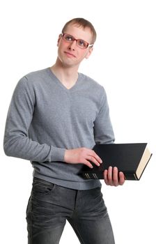 Young student in glasses with a book in their hands. Isolated on white background