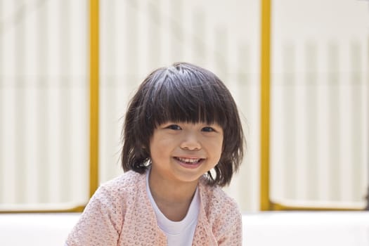 A young asian girl smiling