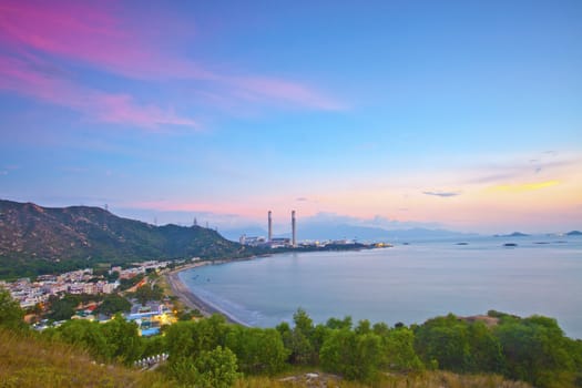 Power station along the seashore at sunset time, Hong Kong.