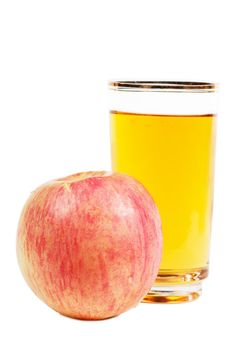 Fresh apple juice in a glass and red apple over white background