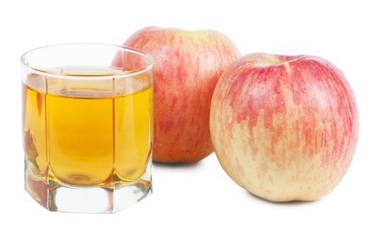 Fresh apple juice in a glass and two red apples over white background