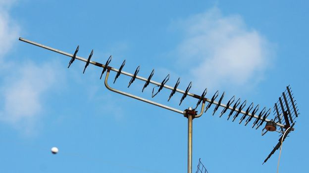 Television antenna in blue sky