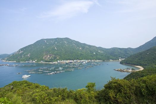 Fishing village from hill top at day 