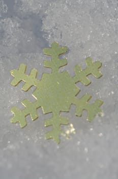 golden snow stars on a real snowy icy surface