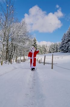 Santa Claus, Father Christmas in a beautiful winter landscape