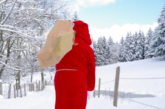 Santa Claus, Father Christmas in a beautiful winter landscape