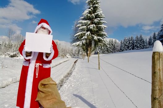 Santa Claus, Father Christmas holding blank sign