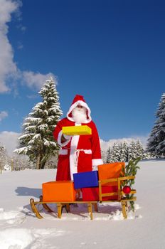 Santa Claus, Father Christmas with colorful presents on a sledge