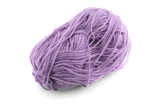 Ball of purple  knitting wool or yarn isolated on white background.