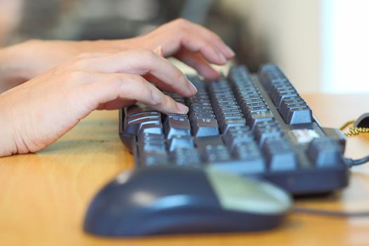 Human hands using computer