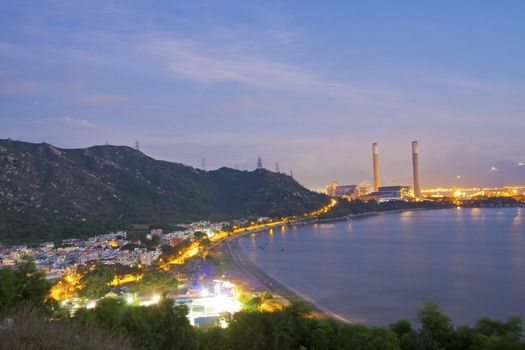 Power station along the seashore at night 