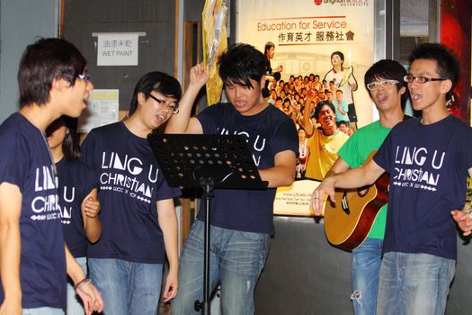 HONG KONG - 24 AUG: Lingnan University holds new student orientation every year to welcome freshmen on 24 August, 2011, Hong Kong. Christian Choir is singing to attract students to join their society. 
