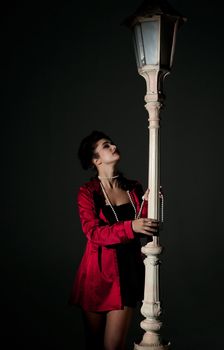 beautiful young glamorous woman  with lightpole