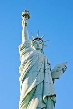 statue of liberty in front of clear blue sky