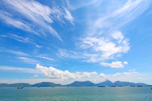 Seascape in Hong Kong at summer time, with moving clouds.