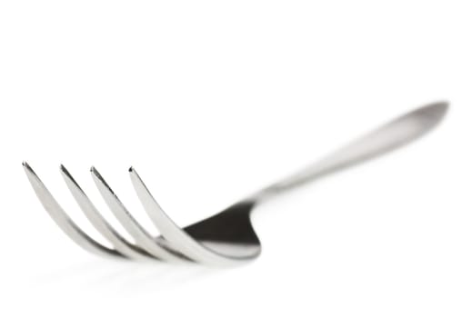 Macro view of fork over white background
