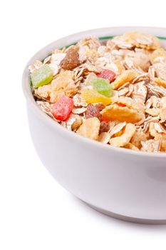 Healthy muesli in a white bowl isolated over white background