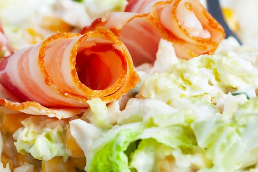 Macro view of salad and ham rolls