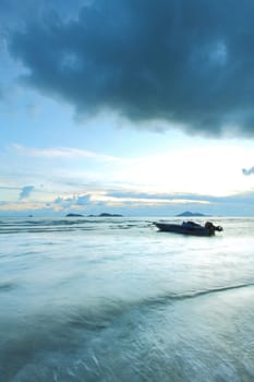 A boat in the sea with thunderstorm coming