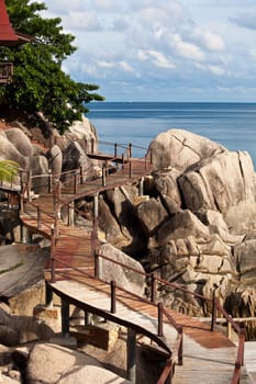 Beautiful wooden bridge on stone