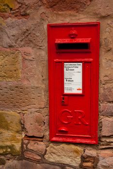 This iconic British Post Box displays a schedule of collection times