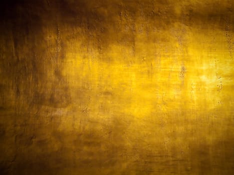 Antique golden grunge background with highlight texture 