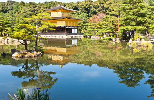 Japanese golden pagoda and reflex on water