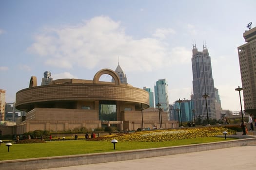 Shanghai downtown at day time, with Shanghai Museum background.