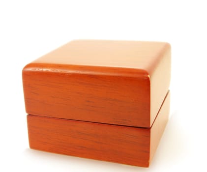 Red wooden jewelry box, closed, isolated towards white