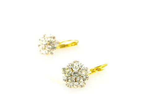 Diamond earrings on yellow gold, isolated towards white background