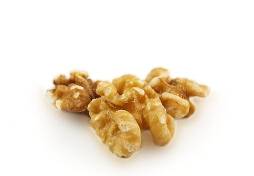 Walnuts in a pile isolated towards white background