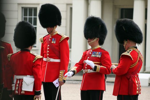 Grenadier guards at attention while inspection by officers