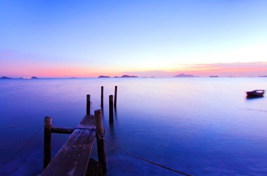 Sunset along a wooden pier at magic hour