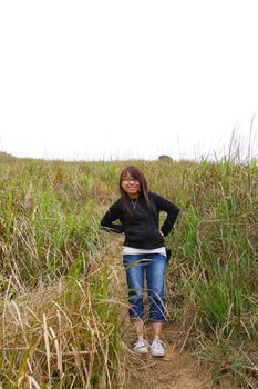 Asian girl hiking with smile